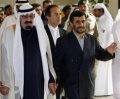 Ahmadinejad abdullah hand holding.jpg